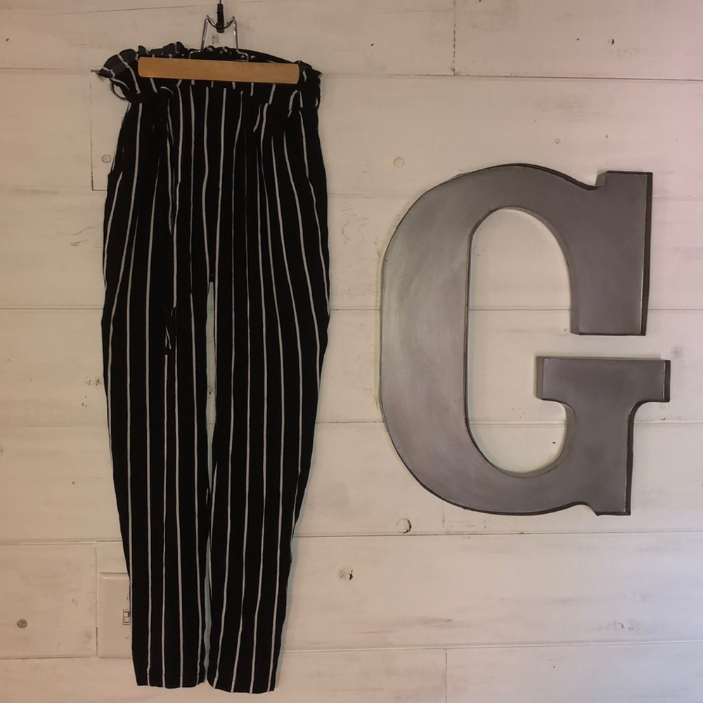 Black pants with white pin stripe